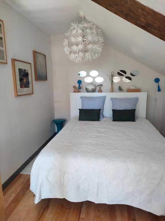 Postel nebo postele na pokoji v ubytování La Suite 27 bis