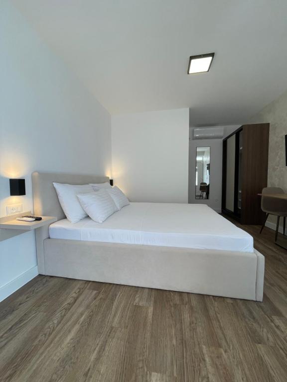 Postel nebo postele na pokoji v ubytování Apartments Njavro Neum