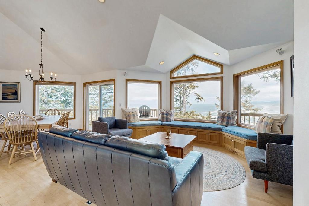 a living room with a couch and a table at Eagle's View in Neskowin