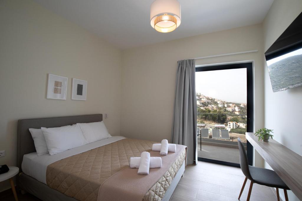 Postel nebo postele na pokoji v ubytování Trinasus Hotel