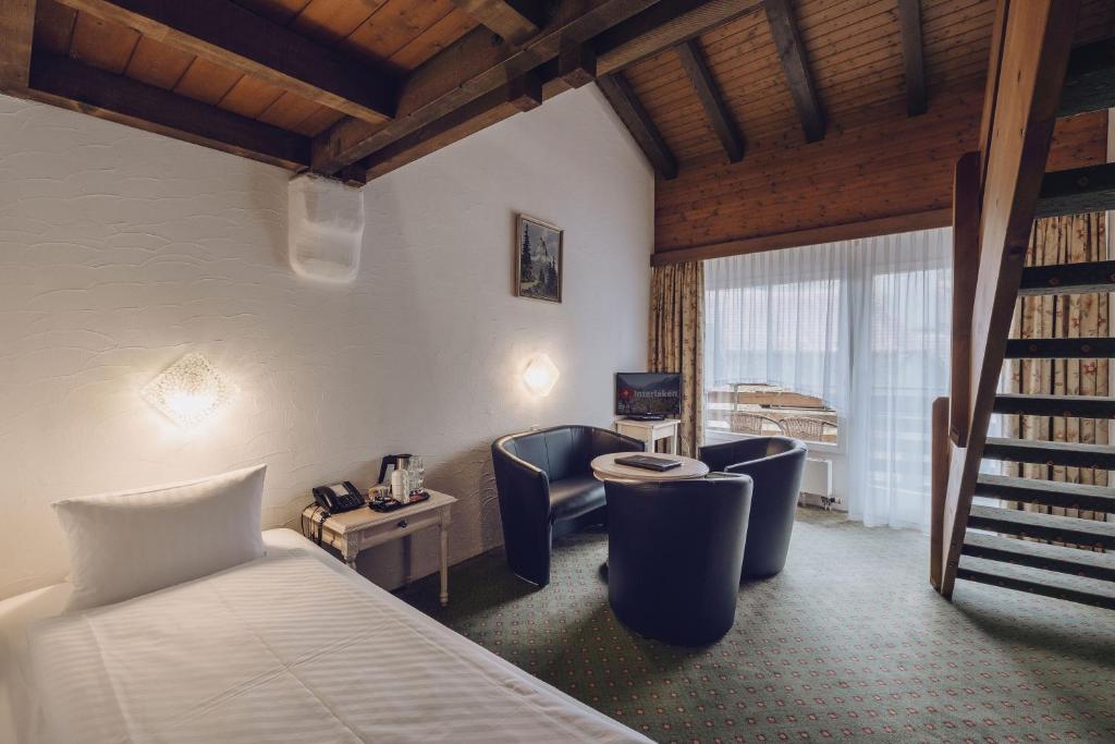 Letto o letti in una camera di Hotel Chalet Swiss