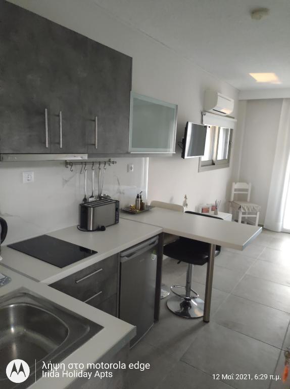 A kitchen or kitchenette at Irida Holiday Apartments