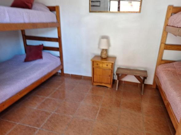 Postel nebo postele na pokoji v ubytování Hostal Las Kañas