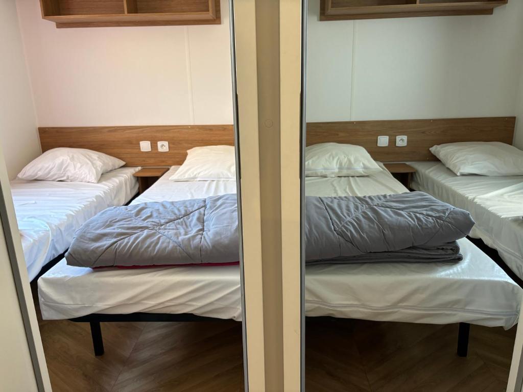 Postel nebo postele na pokoji v ubytování M H 3 Chambres
