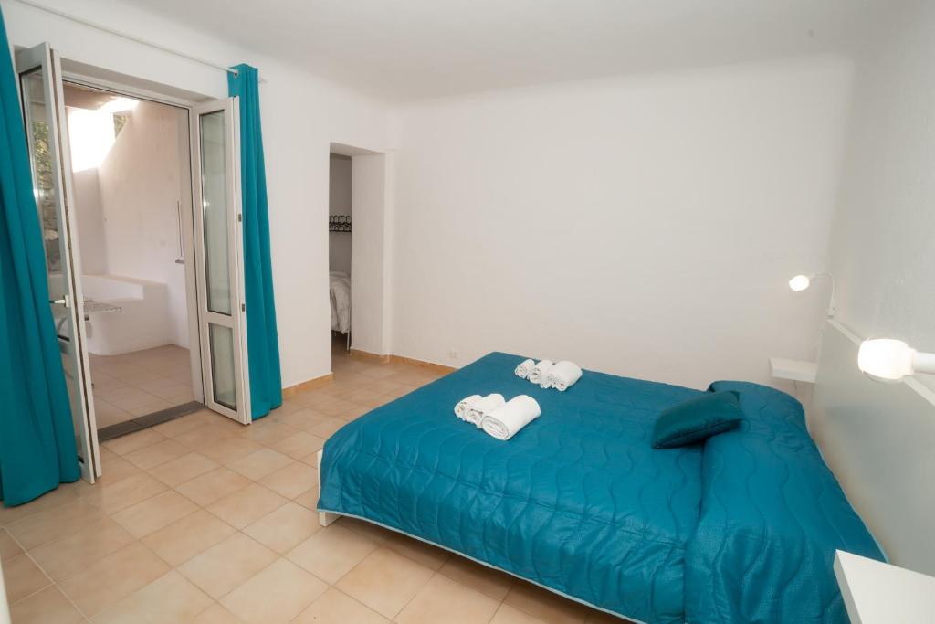 Letto o letti in una camera di Residence Palummera