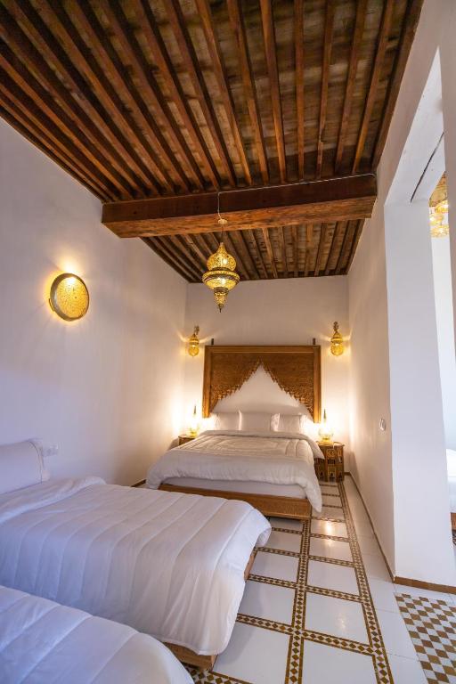 Postel nebo postele na pokoji v ubytování Riad Old City Palace
