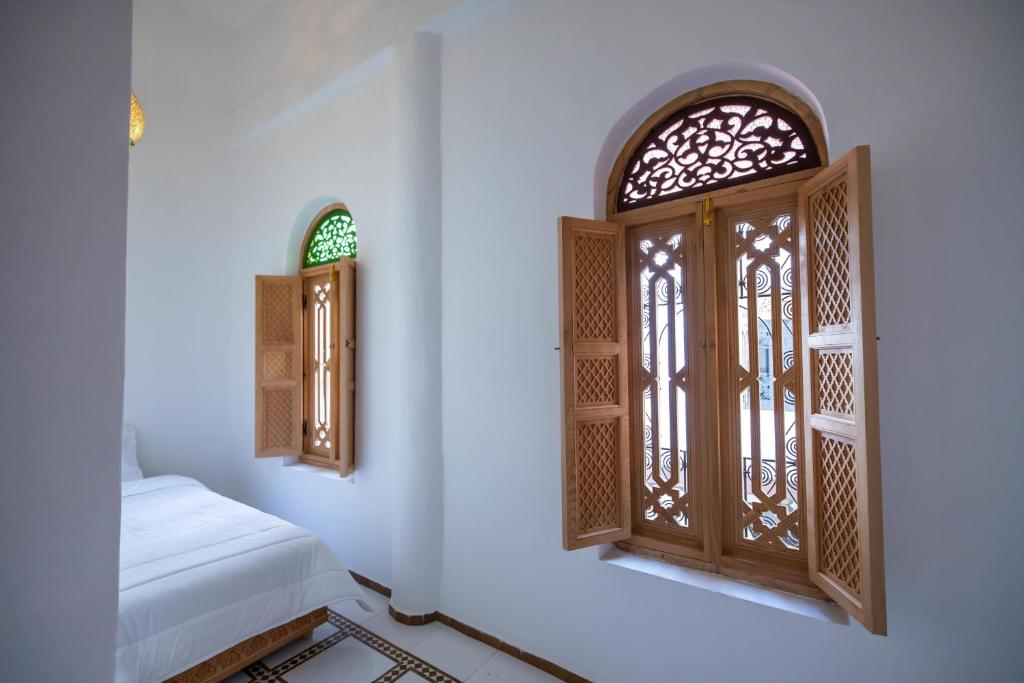 Postel nebo postele na pokoji v ubytování Riad Old City Palace