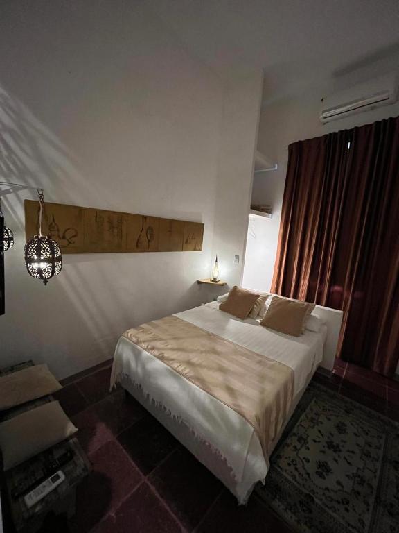 Postel nebo postele na pokoji v ubytování Apto com Arte no Pelourinho