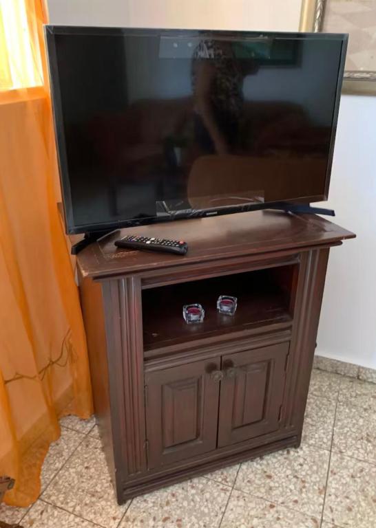 TV a/nebo společenská místnost v ubytování Hermes Casa Len