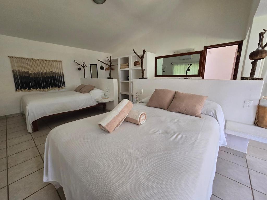 Postel nebo postele na pokoji v ubytování Hotel Taboga Eco Boutique & Spa Costa Esmeralda