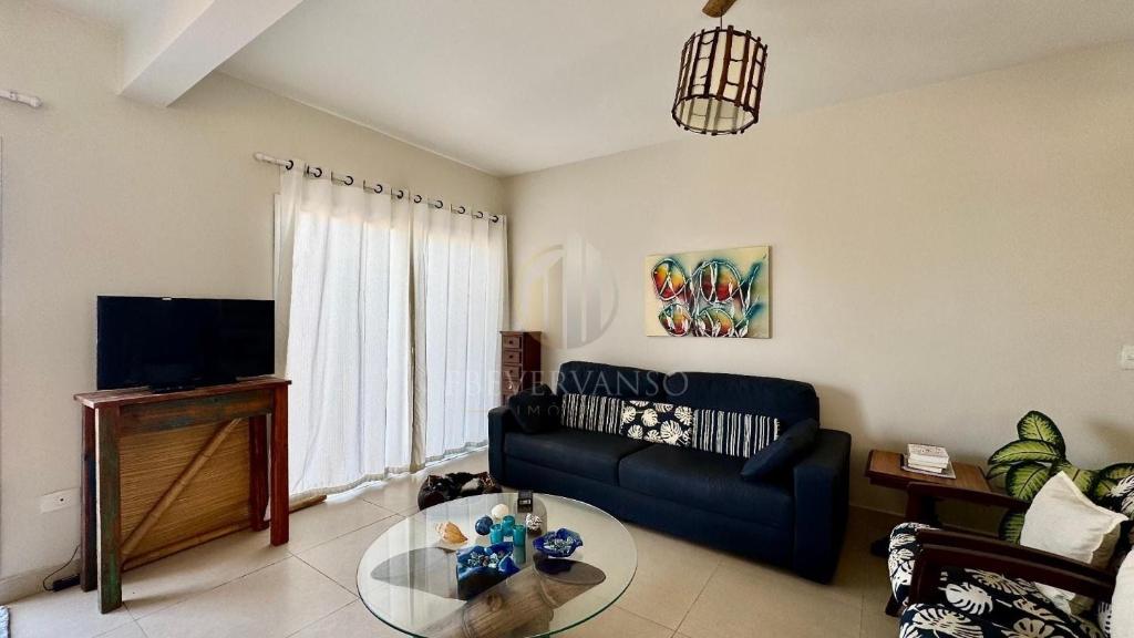 Televisyen dan/atau pusat hiburan di Piscina e Wi-Fi -Frente para o Mar triplex