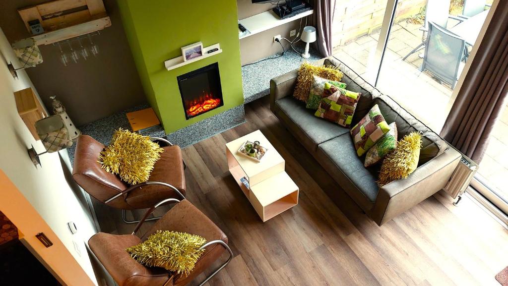 an overhead view of a living room with a fireplace at Vakantiehuis Jade in Bruinisse