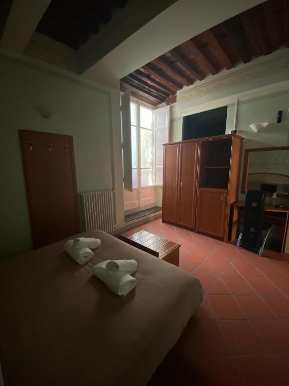 Postel nebo postele na pokoji v ubytování Le Sette Lune Rooms