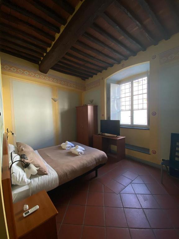 Postel nebo postele na pokoji v ubytování Le Sette Lune Rooms