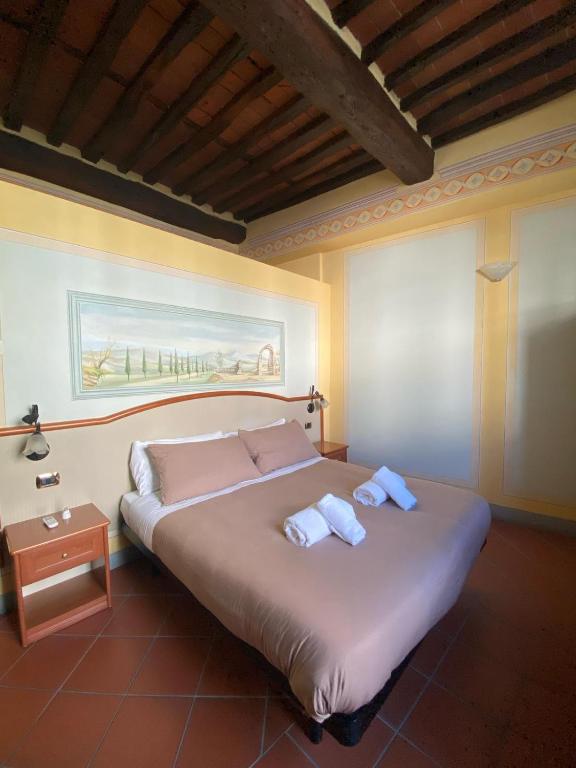 Postel nebo postele na pokoji v ubytování Le Sette Lune Rooms