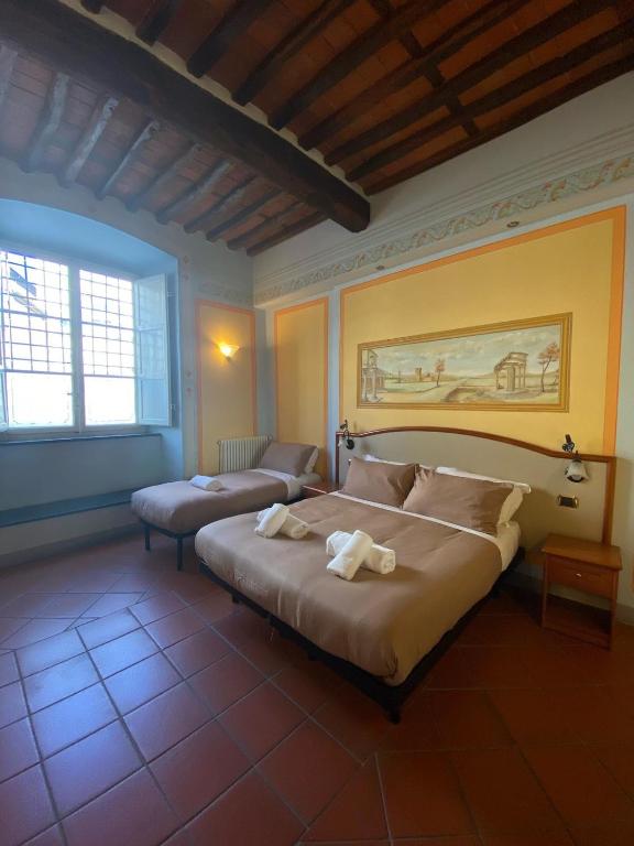 Postel nebo postele na pokoji v ubytování Le Sette Lune Rooms