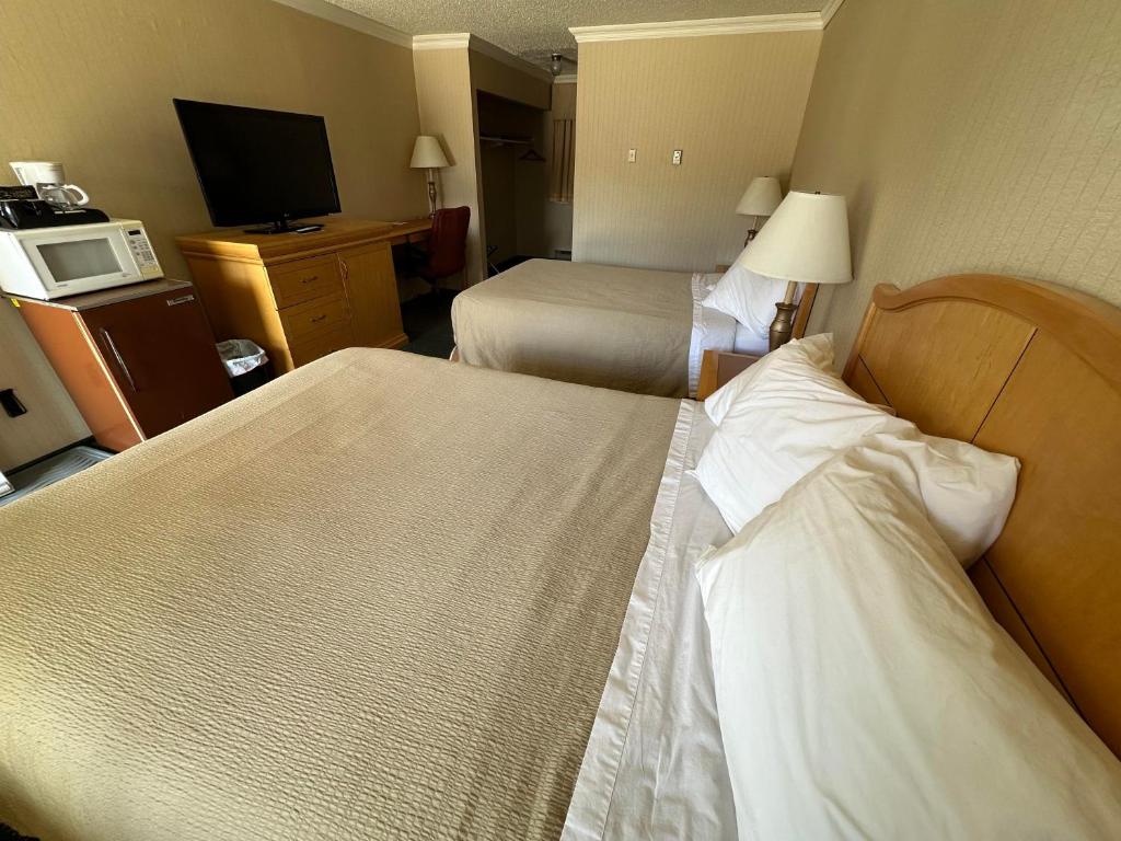 Postel nebo postele na pokoji v ubytování Stagecoach Inn