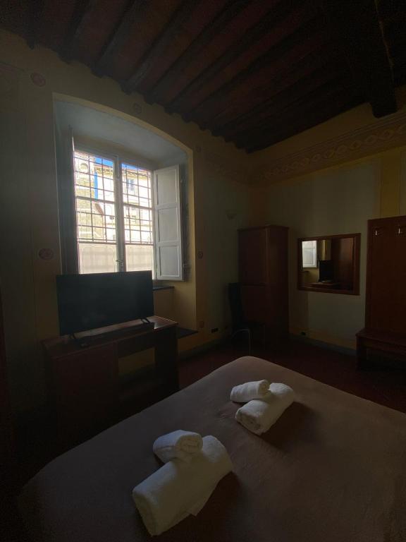 Postel nebo postele na pokoji v ubytování Le Sette Lune Rooms
