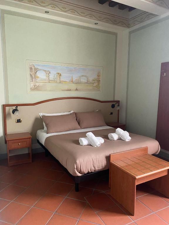 Postel nebo postele na pokoji v ubytování Le Sette Lune Rooms