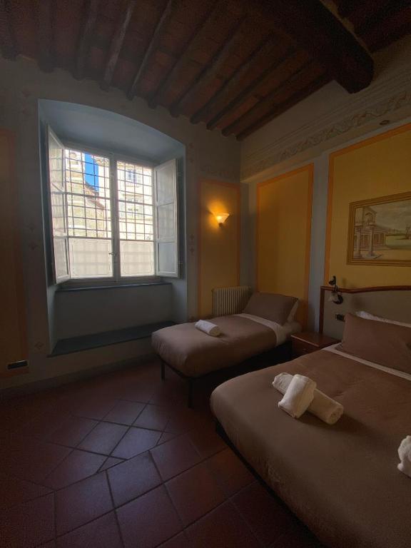 Postel nebo postele na pokoji v ubytování Le Sette Lune Rooms