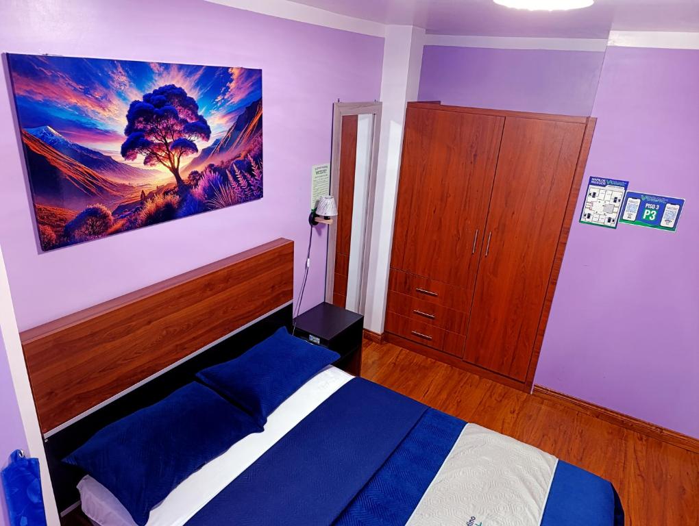 Postel nebo postele na pokoji v ubytování Hostal Valle Andino