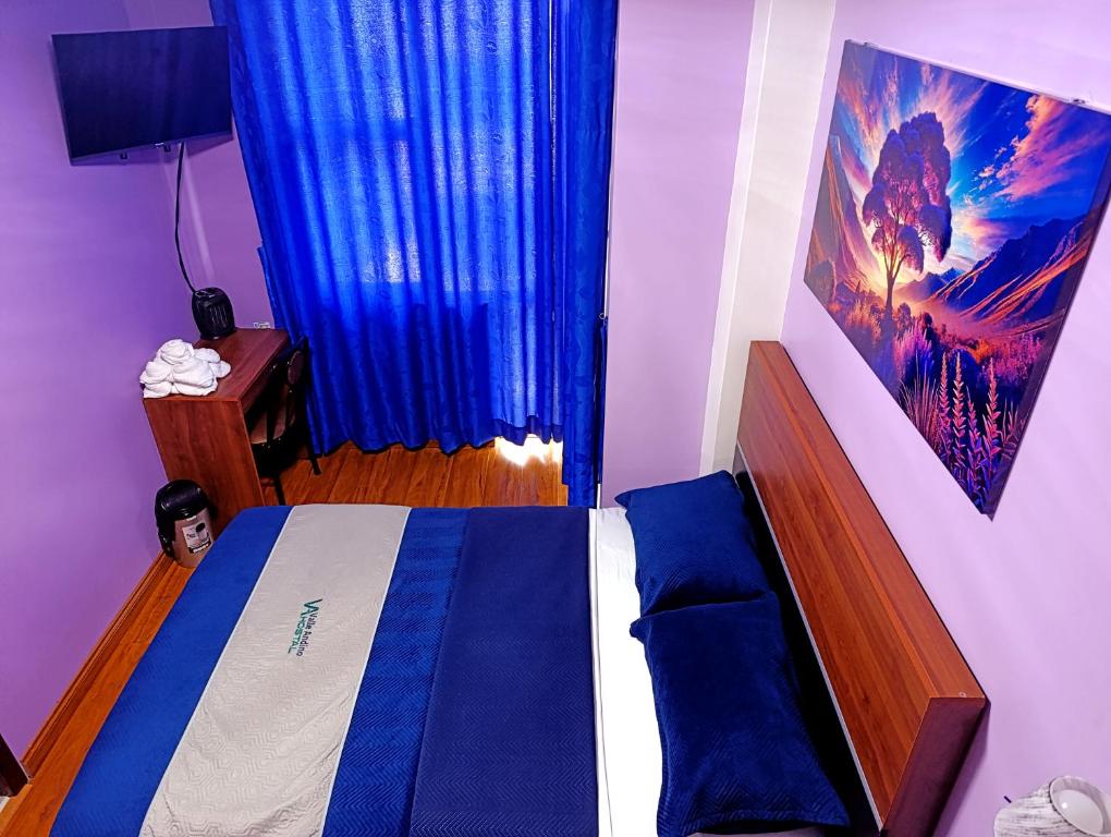 Postel nebo postele na pokoji v ubytování Hostal Valle Andino