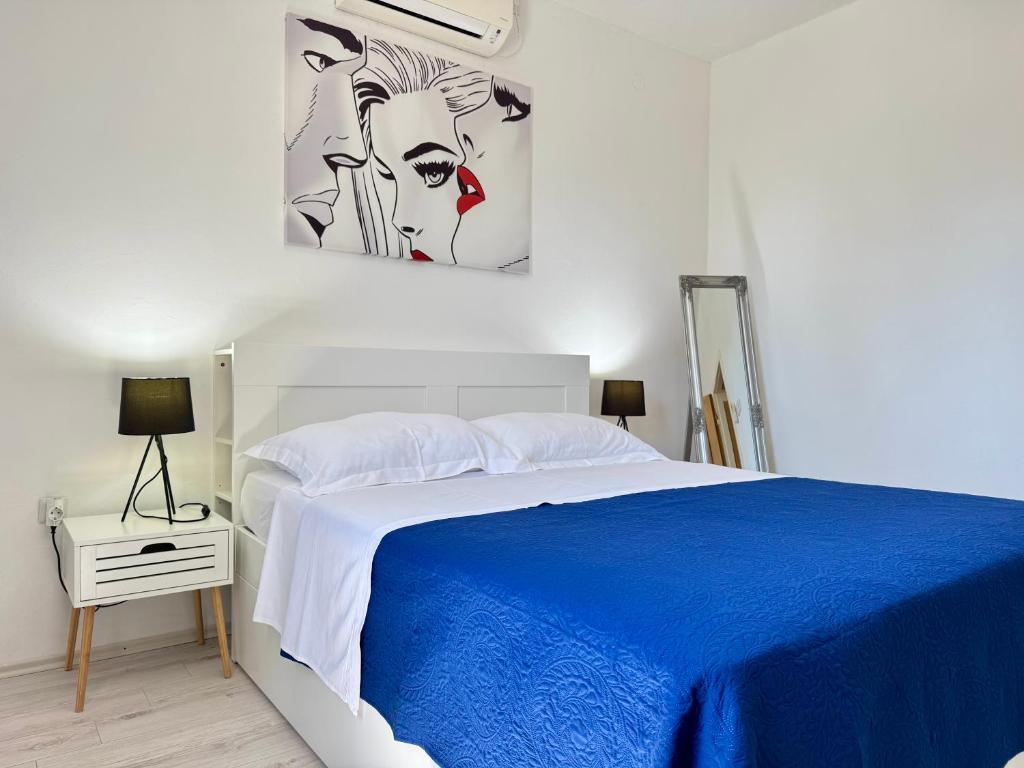 Posteľ alebo postele v izbe v ubytovaní Holiday Home Lungo Mare
