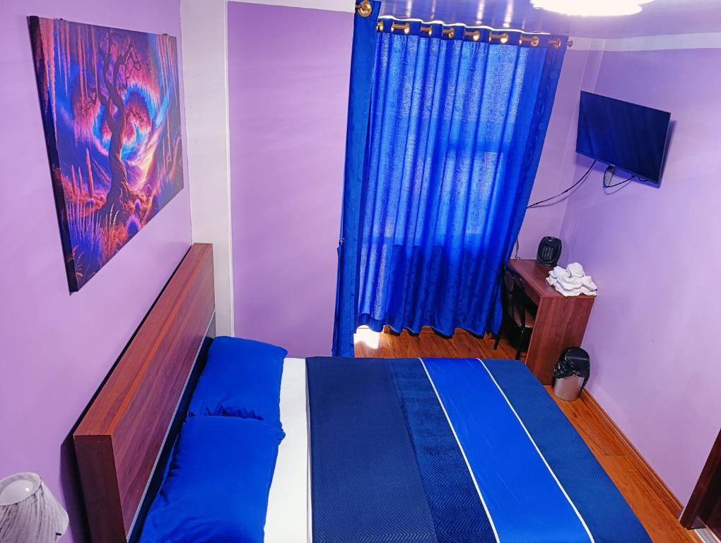 Postel nebo postele na pokoji v ubytování Hostal Valle Andino