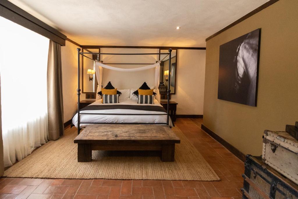 Postel nebo postele na pokoji v ubytování Hacienda El Salitre Hotel & Spa