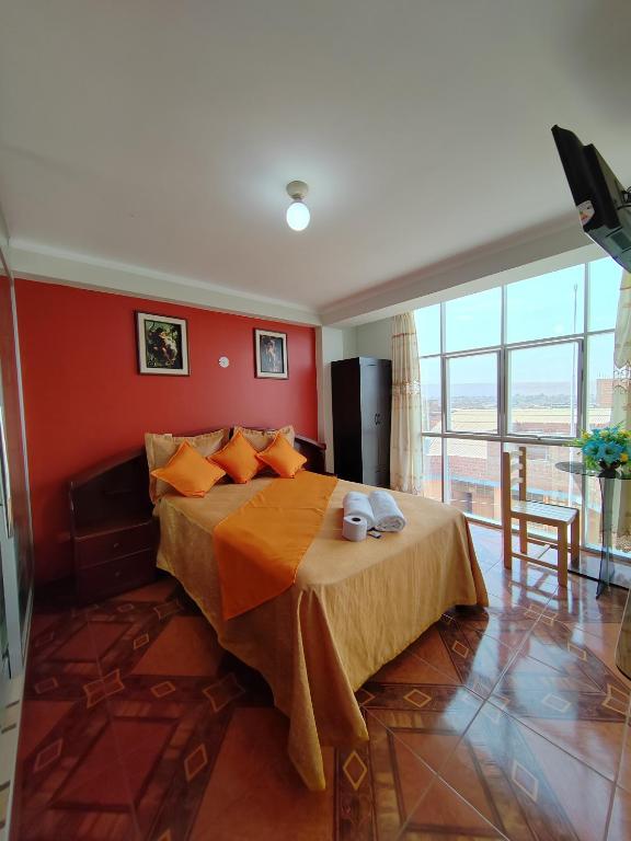 Postel nebo postele na pokoji v ubytování Hostal Bryan