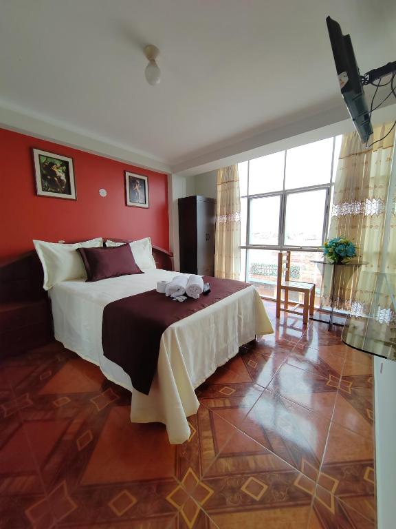 Postel nebo postele na pokoji v ubytování Hostal Bryan