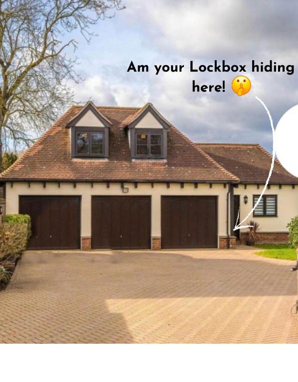 a house with two garage doors and a balloon at Fairy Meadows Hideaway in Peterborough