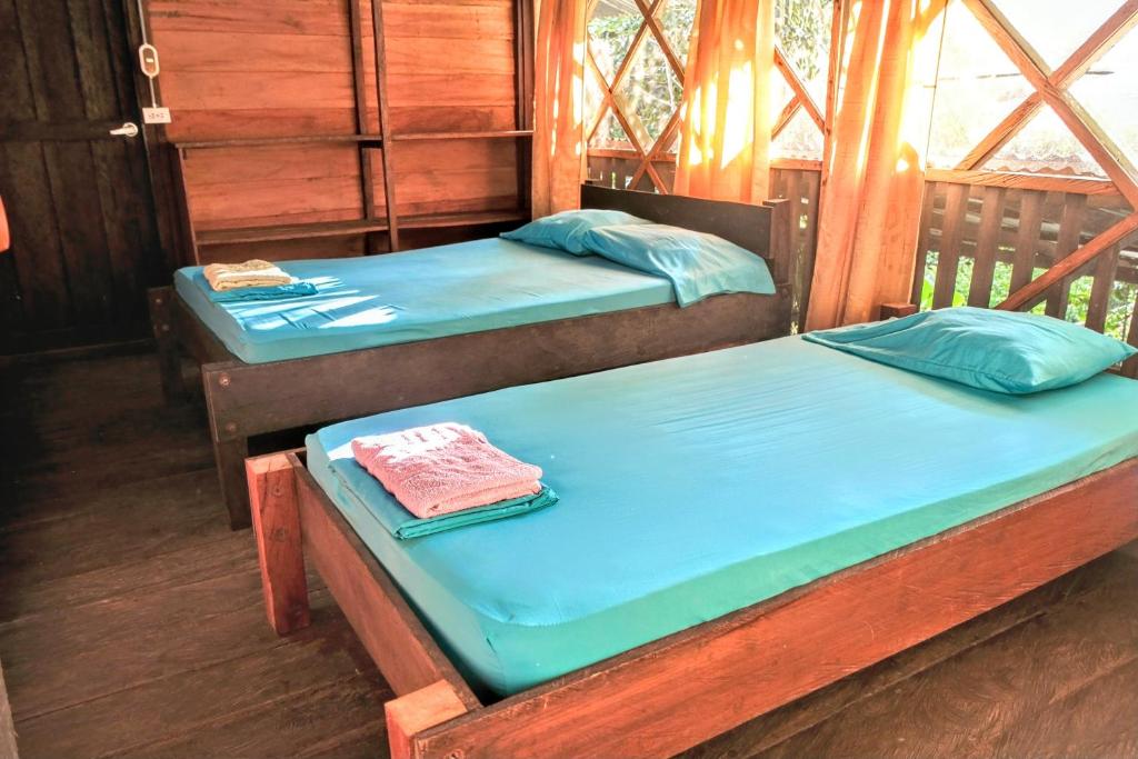 Postel nebo postele na pokoji v ubytování Paraíso Ayahuasca Hotel & Tours