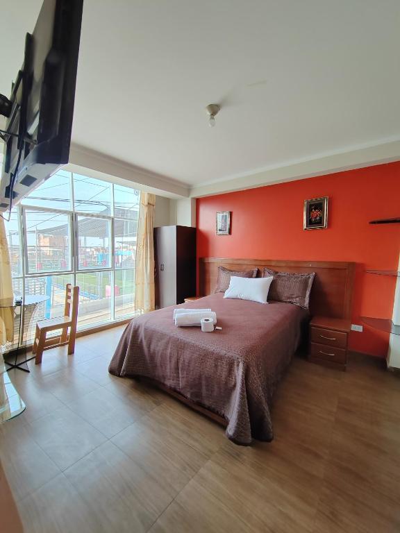 Postel nebo postele na pokoji v ubytování Hostal Bryan