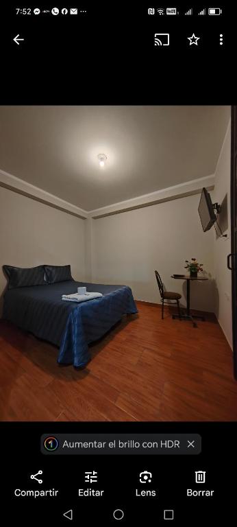 Postel nebo postele na pokoji v ubytování Hostal Bryan