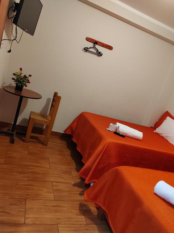 Postel nebo postele na pokoji v ubytování Hostal Bryan