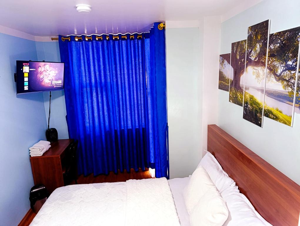 Postel nebo postele na pokoji v ubytování Hostal Valle Andino