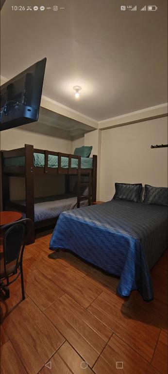 Postel nebo postele na pokoji v ubytování Hostal Bryan