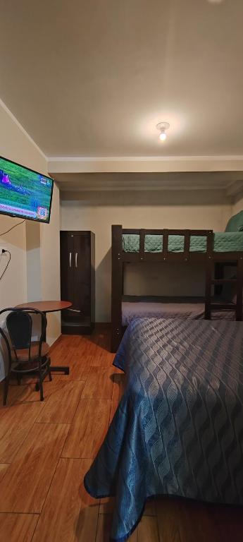 Postel nebo postele na pokoji v ubytování Hostal Bryan