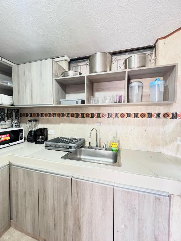 Kuchyň nebo kuchyňský kout v ubytování Alojamiento Casa-posada CAMELL