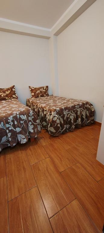 Postel nebo postele na pokoji v ubytování Hostal Bryan