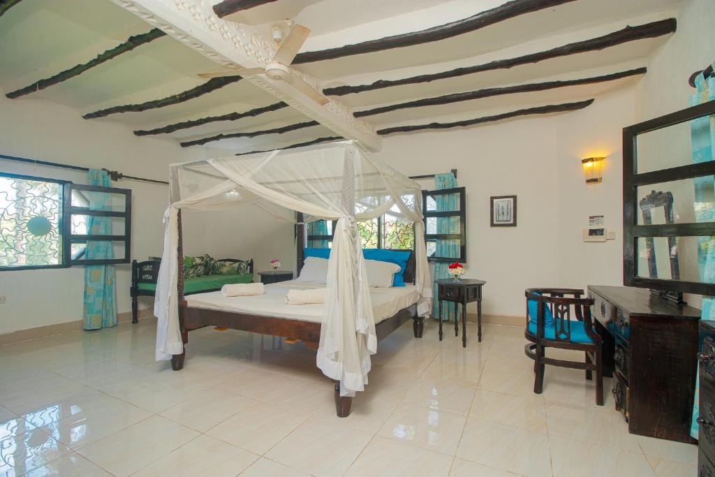 Postel nebo postele na pokoji v ubytování Sunny garden rooms Watamu