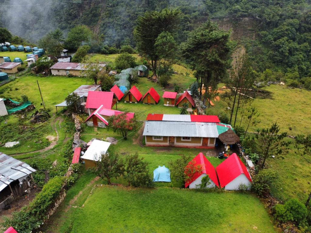an aerial view of a small village with red roofs at Hostel el molle capulichayoc in Santa Teresa