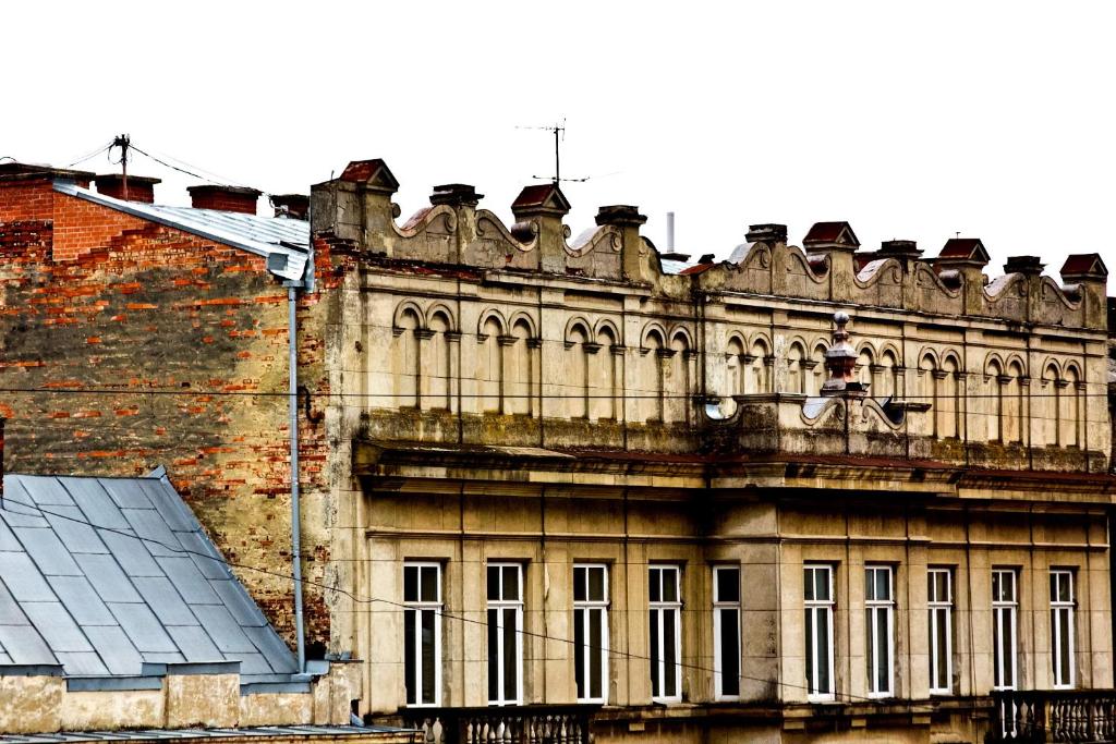 an old building with a lot of windows at Mini-Hotel Under The Roof in Lviv