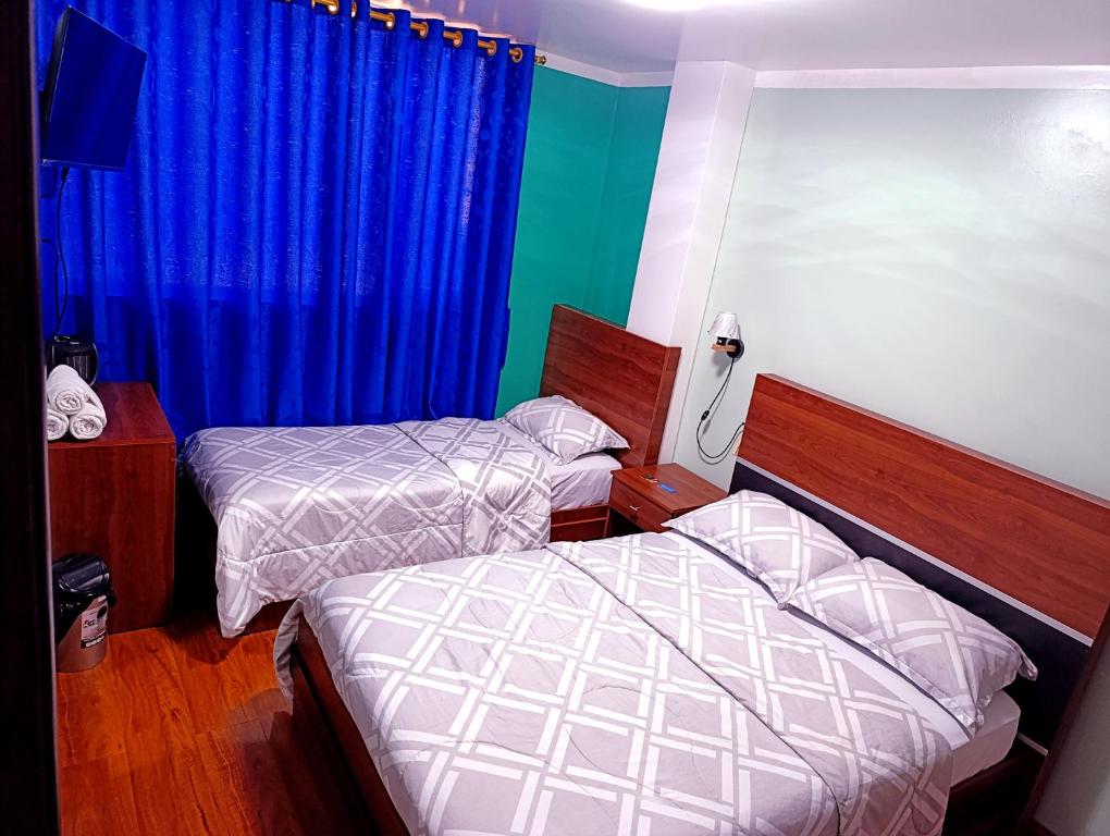 Postel nebo postele na pokoji v ubytování Hostal Valle Andino