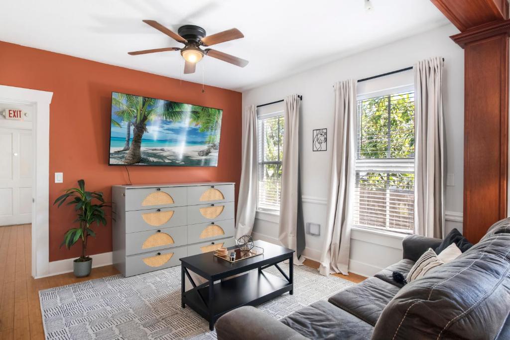 a living room with a couch and a ceiling fan at Updated 1 BR Home - Steps to 7th Ave in Tampa