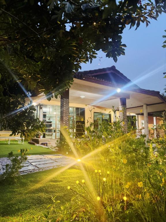 a house with a garden in front of it at Sun and Moon House in Pattaya Central