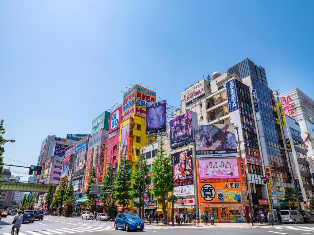 a busy city street with many tall buildings at APA Hotel Akihabara Ekimae in Tokyo