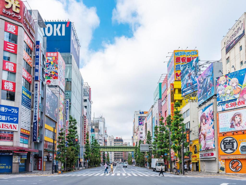 a street in a city with many signs at APA Hotel Akihabara Ekimae in Tokyo