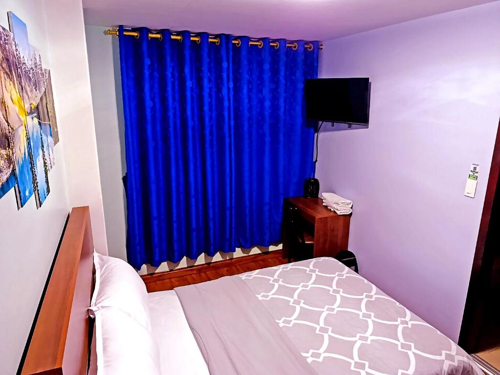 Postel nebo postele na pokoji v ubytování Hostal Valle Andino